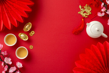 Lunar New Year tea ceremony top view setting featuring Feng Shui elements, teapot set, and green...