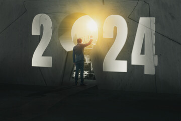 2024 new year numbers on wall, opportunity businessman standing on staircase to looking keyhole...