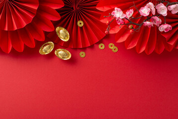 Lunar New Year Celebration theme: Overhead shot of festive fans, feng shui tokens, lucky coins, and...