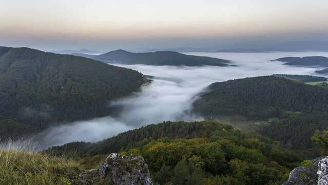 Time lapse of Sunrine autumn landscape in Slovakia rock, Sulov with clouds