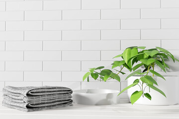 Mockup stack of towels and houseplant on white wooden shelf with place for beauty product promotion, 3d render