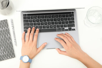 Hands on black laptop keyboard top view