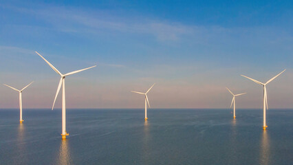 Windmill farm in the ocean Westermeerwind park, windmills isolated at sea on a beautiful bright day in Netherlands Flevoland Noordoostpolder