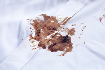 Dirty choclate stain on white shirt