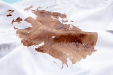 Dirty choclate stain on white shirt