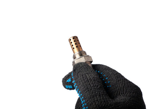 Oxygen sensor for gasoline and diesel engines in the hand isolated on white background. Mechanic holds oxygen sensor. lambda probe