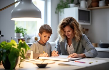 Mother helping her son with homework in kitchen at home