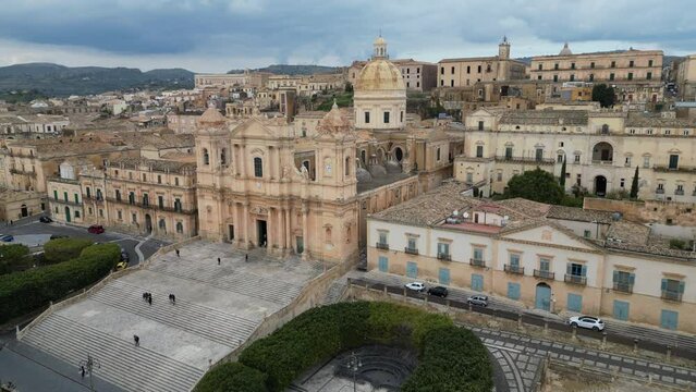 Flying towards baroque church in Noto, architecture and tourism in Sicily Italy
