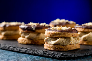 Round nut cookies with coffee and nut cream
