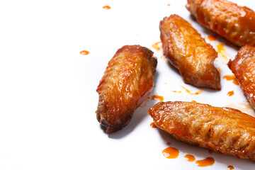Buffalo spicy chicken wings with cayenne pepper sauce isolated on white background