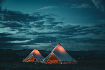 Bell Tents in English Countryside Landscape © olivia