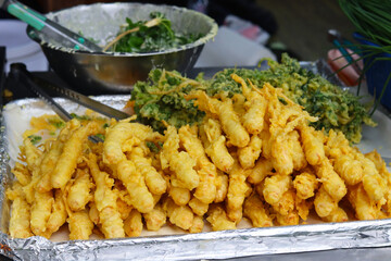 Deep fried golden crispy ginseng the famous street food in South Korea.