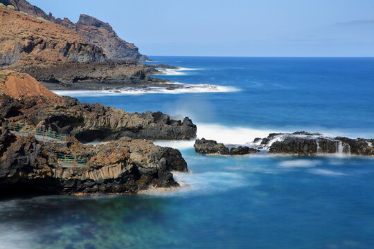 The wild and rocky coast and the natural pools of La Fajana, La Palma, Canary Islands, Spain, located in the North-East of the island 