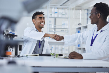 Science, fist bump and men in laboratory in agreement, deal success or onboarding welcome....