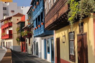 Traditional and colorful houses with wooden balconies located along Maritima avenue in Santa Cruz de la Palma, La Palma, Canary Islands, Spain