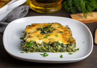Baked Spinach with cheese delicious Italian food cuisine. Spinach gratin.