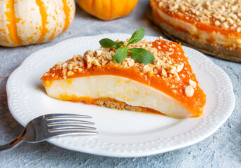 Handmade delicious pumpkin cheesecake and small pumpkins, Turkish name; balkabakli cheesecake. Pumpkin dessert.