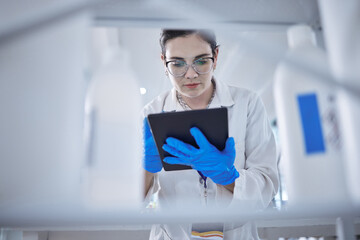 Woman, medical research and tablet in lab for test results check, future pill trial or science...
