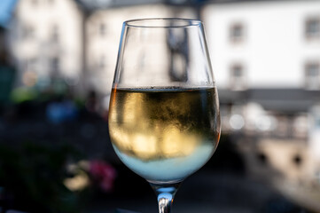 White quality riesling wine served in old restaurant in Vianden, Luxembourg