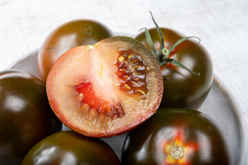 Fresh ripe sweet reddish brown and green kumato tomatoes