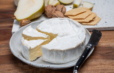 French soft Camembert cheese, original Camembert de Normandie, with white mold