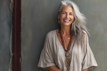 Fototapeta premium portrait of a beautiful 50s mid age beautiful senior model woman with grey hair smiling