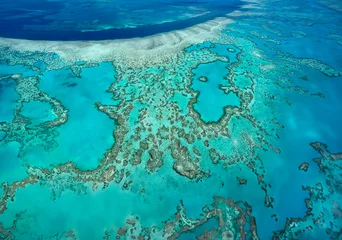 Fotobehang Aerial view of the coral reefs of the Whitsunday Islands off the coast of Queensland, Australia. © mrallen