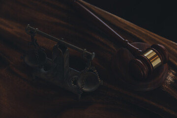Justice and law concept.Male judge in a courtroom with the gavel, working with, computer and...