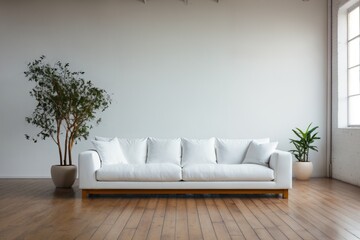 a white sofa, indoor, in front of empty wall background