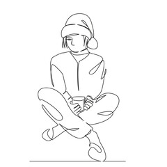 girl in Santa Claus hat drinks hot chocolate