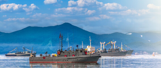 Warships in the maritime parade on bay on Pacific ocean on Kamchatka peninsula