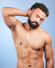 Shower, cleaning and man relax and calm from water, skincare and morning body routine. Bathroom, cosmetics and male model in a studio with blue background and dermatology for wellness and wash