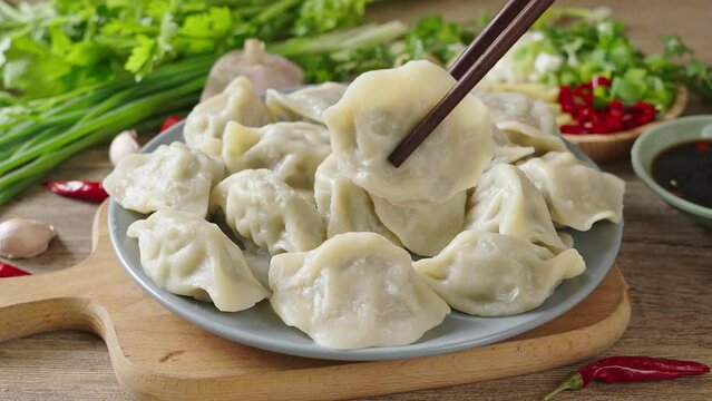 Close up fresh boiled dumplings . traditional food on rustic old wooden background.