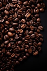 Coffee beans on dark background, top view