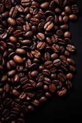 Obraz premium Coffee beans on dark background, top view