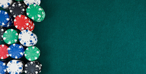 Casino gaming background with stacks of chips on green mat