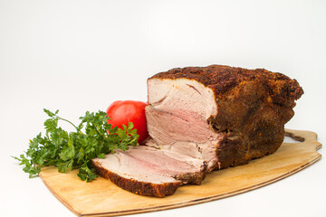 Sliced baked meat on a white background. Delicious homemade meat meal