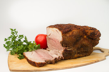 Sliced baked meat on a white background. Delicious homemade meat meal