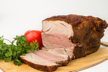 Sliced baked meat on a white background. Delicious homemade meat meal