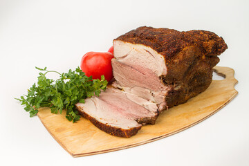 Sliced baked meat on a white background. Delicious homemade meat meal