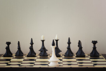 One white king against all black chess pieces. One against all, power imbalance, unequal forces for...
