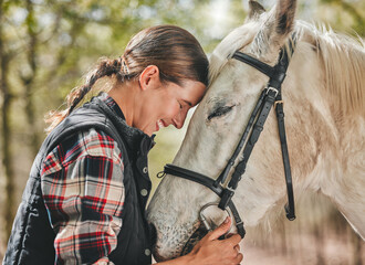 Happy woman with horse in forest, embrace in nature and love for animals, pets or dressage with...