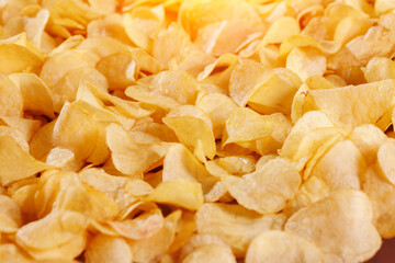 Food Texture of Fresh Crispy potato chips snack background, top view