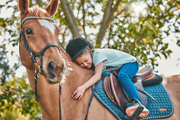 Love, nature and child hugging a horse in a forest riding for entertainment, fun or hobby activity. Adventure, animal and young equestrian girl kid embracing her stallion pet outdoor in the woods. - obrazy, fototapety, plakaty