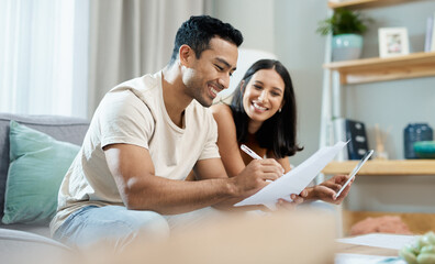 Happy couple, documents and budget planning on sofa in finance, expenses or bills together at home. Man and woman smile with paperwork in living room for loan, financial plan or insurance at house