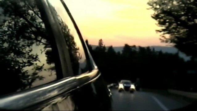 Retro VHS footage, Scan from vintage VHS-C Betacam. Retro camera 8 mm. Old film. Memories. Retro VHS Tape Effect Home Video Concept. Driving with a car. Sunset in the background, travel concept