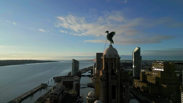 Liverpool, Merseyside, UK, August 9, 2023; Aerial orbit clip of the Royal Liver Building and Liverpool Docks Pier Head Waterfront, Liverpool, Merseyside