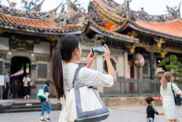 Travel woman visit the Longshan Temple in Taipei city