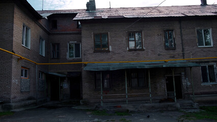 Old house needs major renovation. Clip. Concept of poverty, terrible old brick two storey residential building.