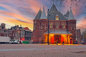 De Waag building in Amsterdam the Netherlands at dusk - obrazy, fototapety, plakaty